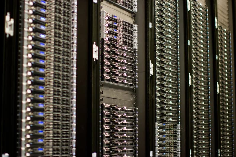 Rows of rack-mounted servers with network cabling in a Wikimedia Foundation server room