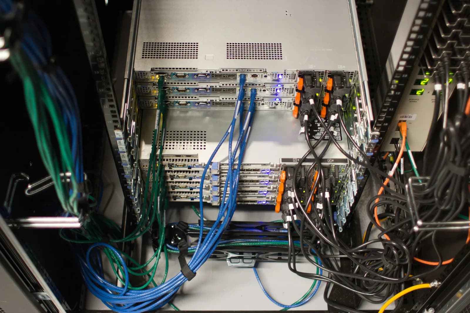 Rows of rack-mounted servers with status lights in a Wikimedia Foundation data centre