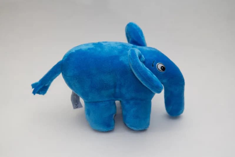 Blue plush elePHPant toy, the PHP community mascot, on a plain background