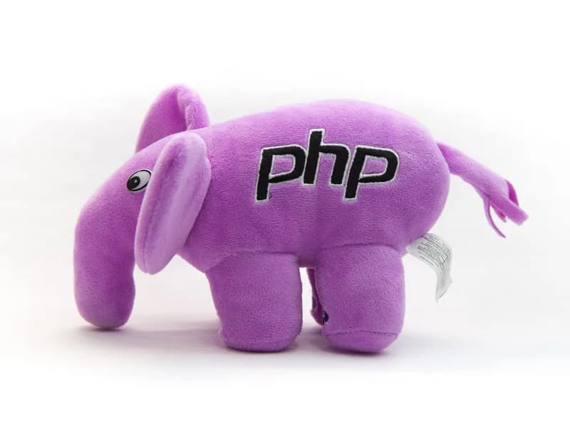 Purple plush elephant toy with the php logo embroidered on its side, on a white background