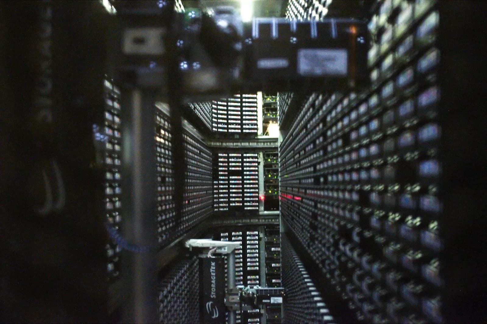Interior of a StorageTek robotic tape library with rows of backup cartridges at NERSC