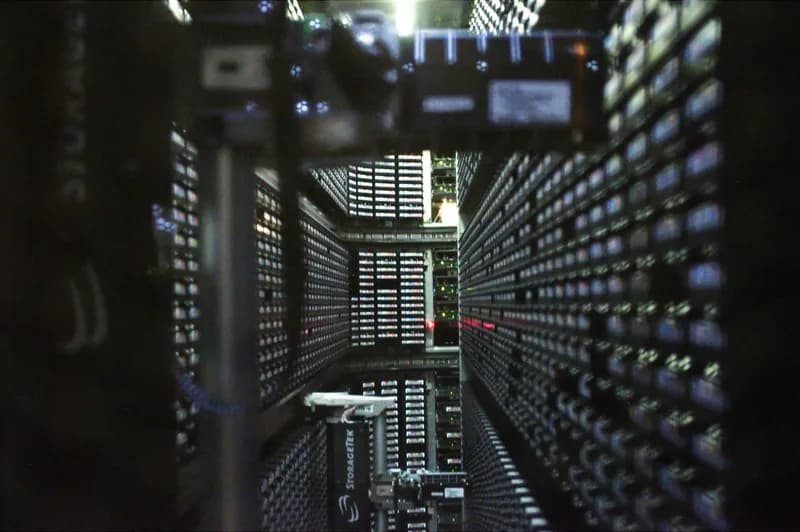 Interior of a StorageTek robotic tape library with rows of backup cartridges at NERSC
