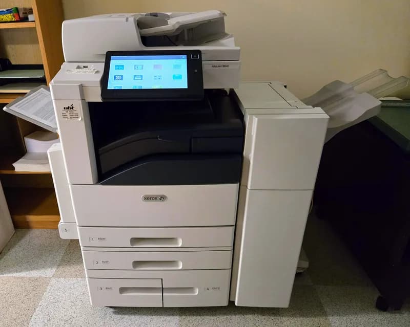 Xerox AltaLink C8045 office photocopier with a touch screen control panel and paper trays