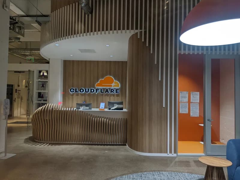 Reception area of a Cloudflare office with the Cloudflare logo.