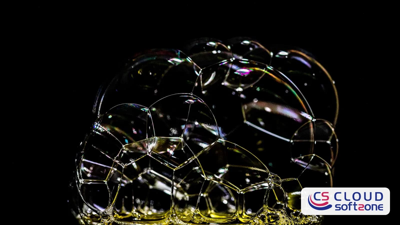 A cluster of soap bubbles of different sizes against a black background, with the Cloudsoft Zone logo in the corner